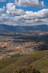 Beautiful view of the large Mexican city of Oaxaca from Monte Alban. View of the endless mountain peaks.