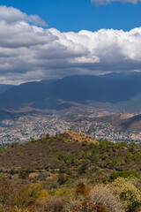 Fototapeta na wymiar Beautiful view of the large Mexican city of Oaxaca from Monte Alban. View of the endless mountain peaks.