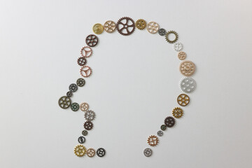 Many different gears shaped as human head on white background.
