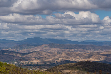 Beautiful view of the large Mexican city of Oaxaca from Monte Alban. View of the endless mountain peaks.