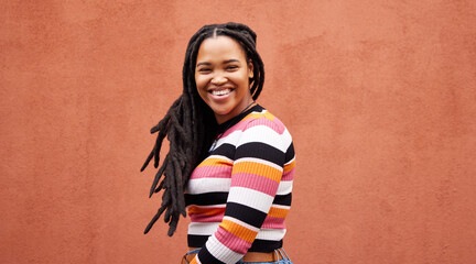 Portrait, wall and black woman with smile, fashion and freedom with joy, success and casual outfit....