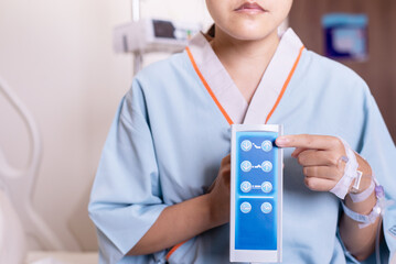 Patient woman hands using remote control for adjust level sickbed at hospital