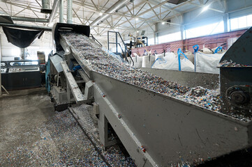 Chopped waste plastic transported by production line