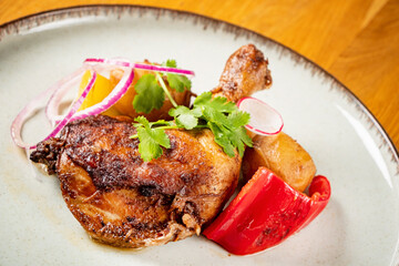 chicken with baked potato and vegetables