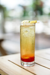 Rose Star Tea Iced Cold on wooden table background. Star anise, lemon and dried fruit. Still Life concept