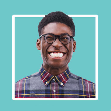 Portrait, black man and excited smile in studio with glasses on color frame, border and background. Funny face, happy male model and nerd smiling with confidence, happiness and confident young geek