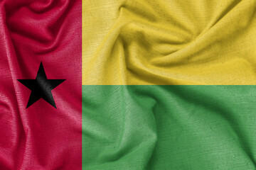 Fototapeta premium Guinea-Bissau country flag background realistic silk fabric