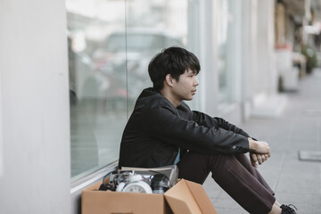 Employees fired or resigned from the company sitting stressed, discouraged in front of the...