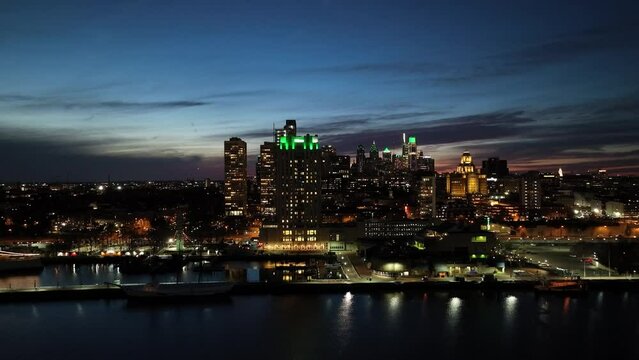 Aerial View of Center City Philadelphia at Night Lit Green for Philadelphia Eagles Superbowl
