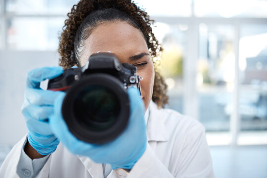 Camera, medical and forensics with black woman in laboratory for investigation, crime scene and photography evidence. Research, analytics and observation with girl and digital pictures for science