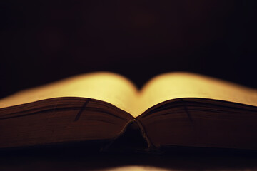 Book on a wooden table background with copy space. Historical atmosphere. Vintage english style....