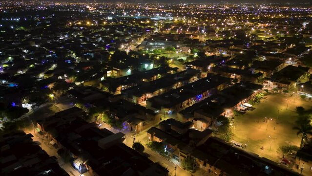 Illuminated heights: aerial hiperlapse of Potrero Grande neighborhood at night, Cali, Valle del Cauca, Colombia