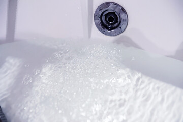 Soap bubbles background. Shampoo foam in the water in the bathroom. Jacuzzi elements.