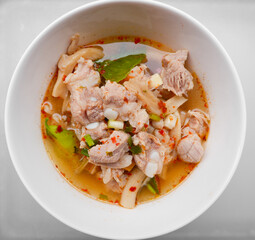 Spicy Soup with Pork Bones in a cup on the table