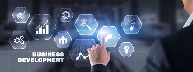 Businessman presses Business Development on city background