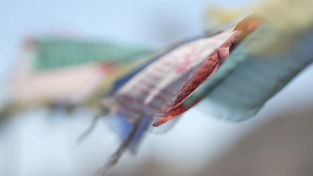 Lungta Prayer flags flying in the wind on blur blue background at LEH LADAKH , INDIA 
