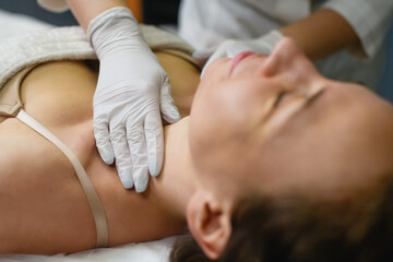 Fototapeta na wymiar Woman lay down in cosmetology beauty clinic