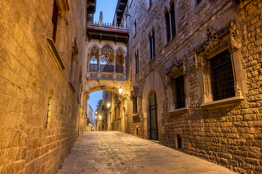 The historic Barrio Gotico in Barcelona at twilight with the Pont del Bispe