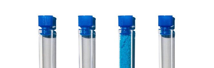 Blue flake chemical in test tube with plug cap, Copper(II) sulfate. Cosmetic chemicals ingredient...