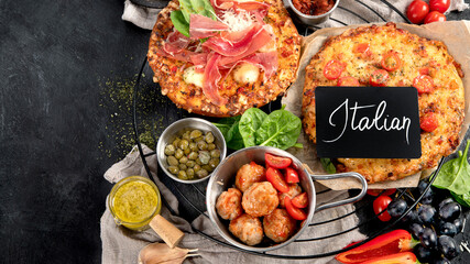 Dinner table of italian meals dishes.