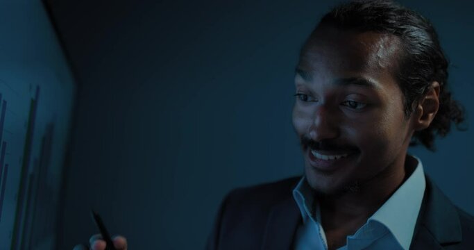 closeup portrait of african business expert, showing strategy plan on digital display, 4K, Prores