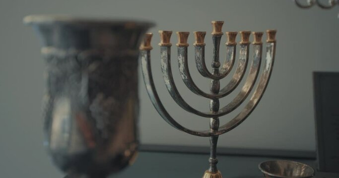 Jewish Hanukkah Menorah and a Wine Kiddush Cup for Shabbat and Holidays 02 - rack focus