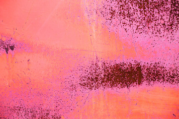 Rusty pink metal abstract background. Texture of an old plate with dripping stained cracked paint