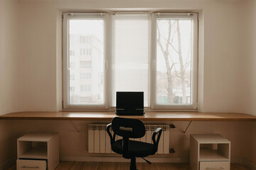 workplace by the window, the table is made from a window sill.