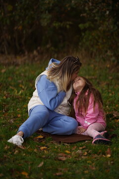 Happy mother having fun with her daughter outdoor - Family and love concept