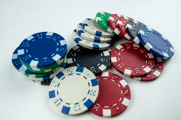 Stacks of different casino chips isolated on white. Texas holdem poker