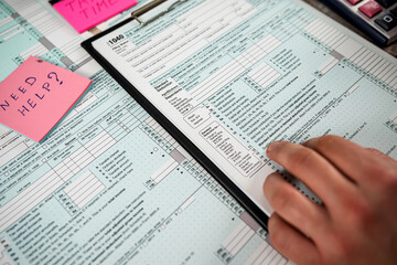 Man work with 1040 blank individual income tax return form