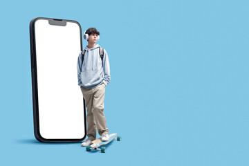 Teenage skater and big smartphone