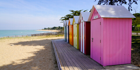 La Bree-les-Bains village wooden brightly coloured beach huts on West atlantic beach french oleron...