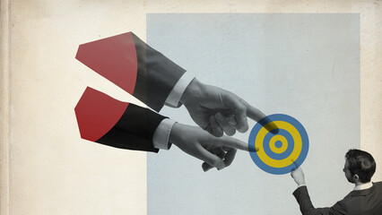 Business people pointing at the target