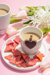 Valentine's Day romantic concept. Morning coffee, a bouquet of tulips, symbolic decor