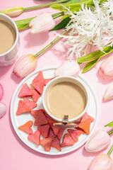 Valentine's Day romantic concept. Morning coffee, a bouquet of tulips, symbolic decor
