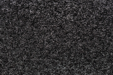 Velcro texture. Black fabric background. Textile pattern. Dark plastic fibers closeup. Fastening...