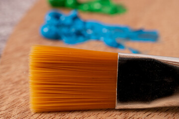 foreground brush with out-of-focus oil paint colors