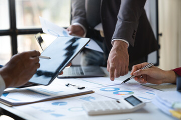 Asian entrepreneurs and businessmen meet in the office for business planning and financial budgets and assess investment risks To analyze customer groups to increase the growth of the company.