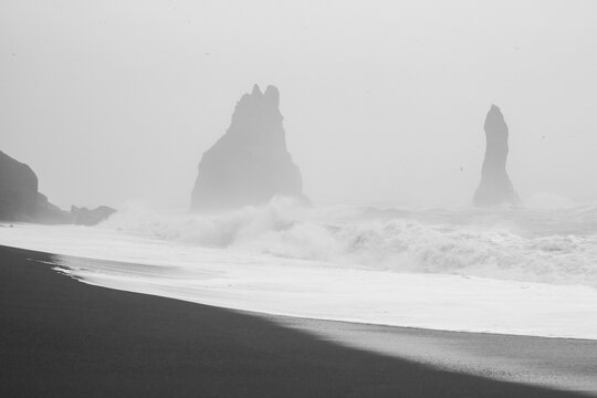 Spicky cliffs on stormy day monochrome landscape photo. Beautiful nature scenery photography with mist on background. Idyllic scene. High quality picture for wallpaper, travel blog, magazine, article