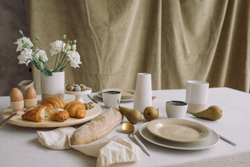 Delicious breakfast on table with flowers.
