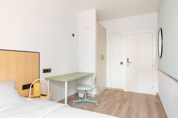 Brightly lit room with daylight bright light. Room for extended stay. Wardrobe for clothes, table and chair for working space, bed for sound sleep. Entrance door with electronic lock.