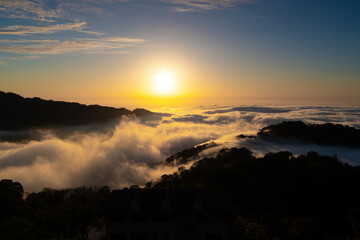 Layers of surging clouds are very spectacular. Sunset behind the mountains. The sea of clouds landscape. Dahu Township, Miaoli County, Taiwan