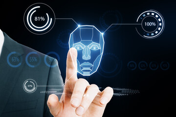 Obraz premium AI system in hologram human head with HUD display elements. Artificial Intelligence for VR with tech shapes HUD. Biometric technology, face recognition systems. Businessman hand pointing at screen.