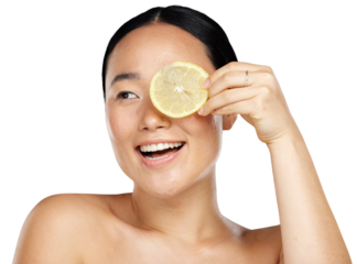 A happy woman using lemon for facial skincare cleaning, vitamin c and cosmetic benefits. An smiling asian beauty model with glowing face holding a lemon slice isolated on a png background