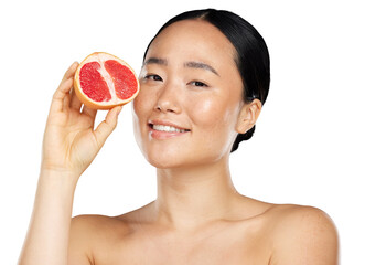 A beautiful asian girl holding a grapefruit for healthy skin care, food for face, wellness, and beauty. A young, happy Asian female model with fruit for nutrition, diet isolated on a png background.