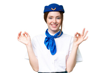 Airplane stewardess over isolated chroma key background showing an ok sign with fingers
