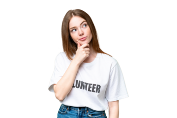 Young volunteer woman over isolated chroma key background and looking up