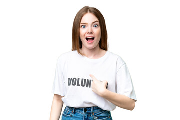 Young volunteer woman over isolated chroma key background with surprise facial expression
