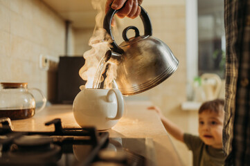 Man pouring hot water in tea pot
